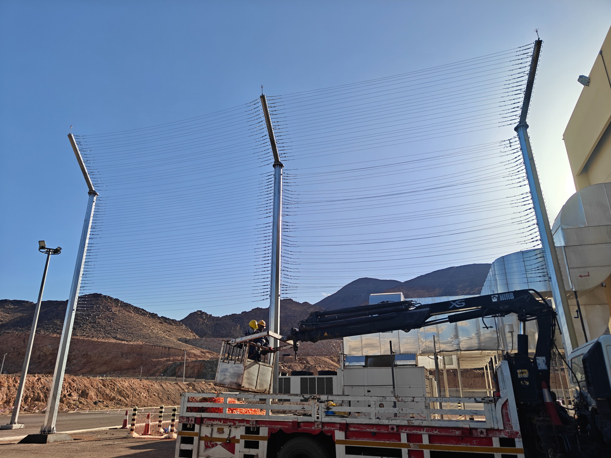 Construction site with work platform and electrical poles